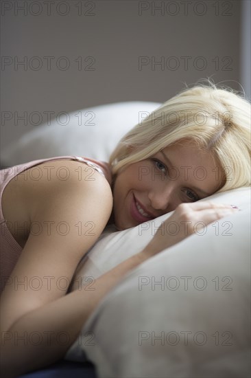 Caucasian woman laying in bed