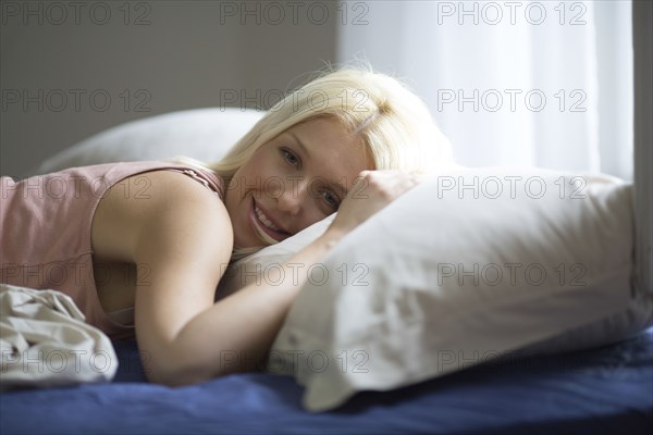 Caucasian woman laying in bed