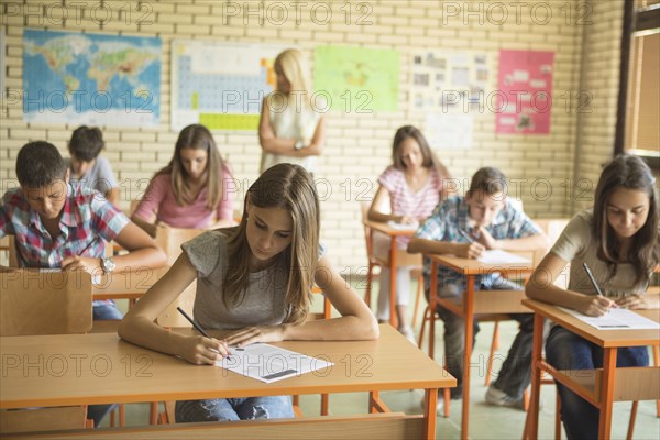 Students taking test in classroom