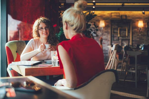 Women drinking coffee in cafe