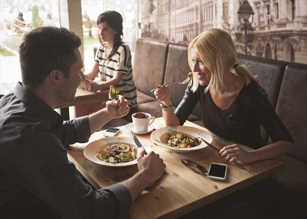 Couple eating in cafe