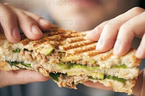 Close up of woman eating sandwich