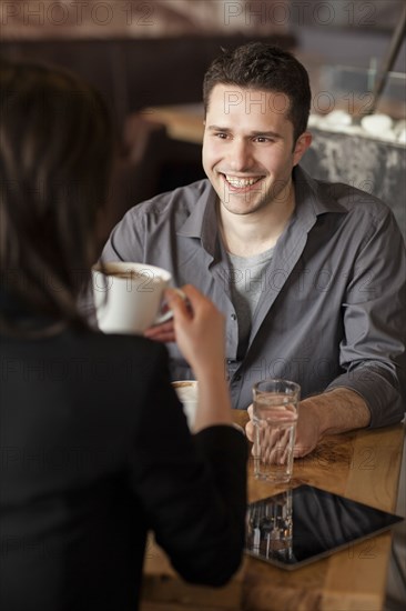 Couple drinking coffee in cafe