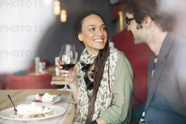 Couple talking in cafe