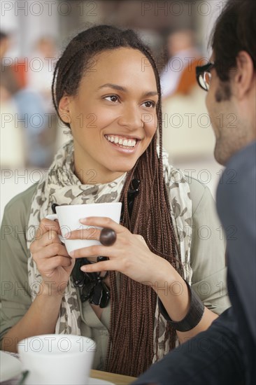 Couple drinking coffee in cafe