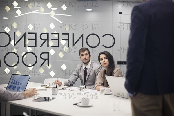 Caucasian business people listening in office meeting