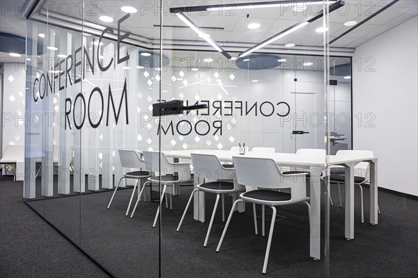 Table and chairs in empty office conference room