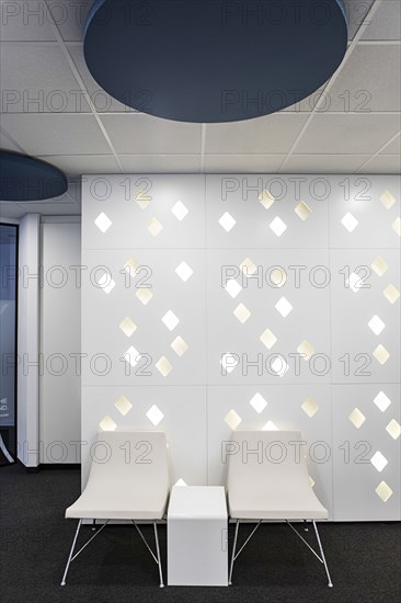 Empty chairs in office lobby