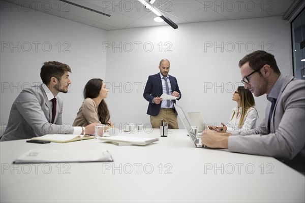Caucasian business people sitting in office meeting