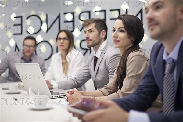 Caucasian business people listening in office meeting