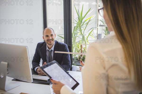 Caucasian business people talking in office