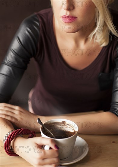 Woman drinking cup of coffee