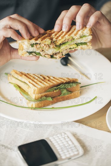 Close up of man eating sandwich