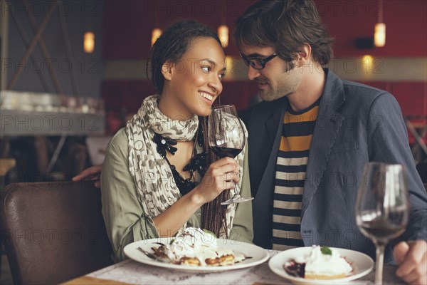 Couple eating dinner in cafe