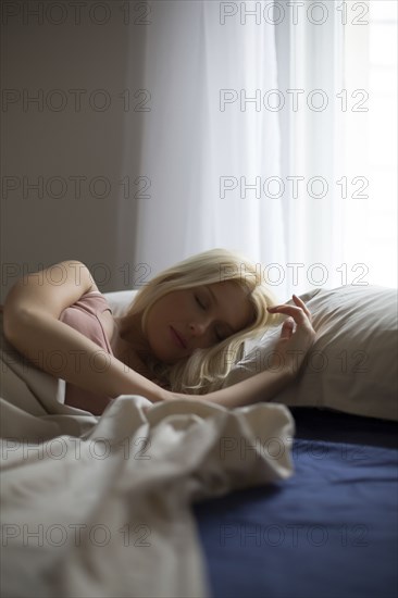 Close up of woman sleeping in bed