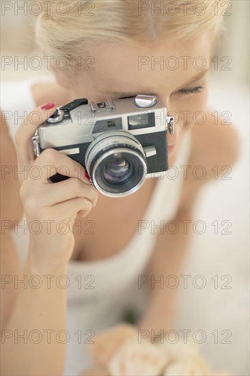 Bride photographing with vintage camera