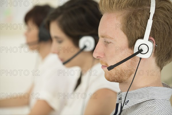 Close up of business people wearing headsets