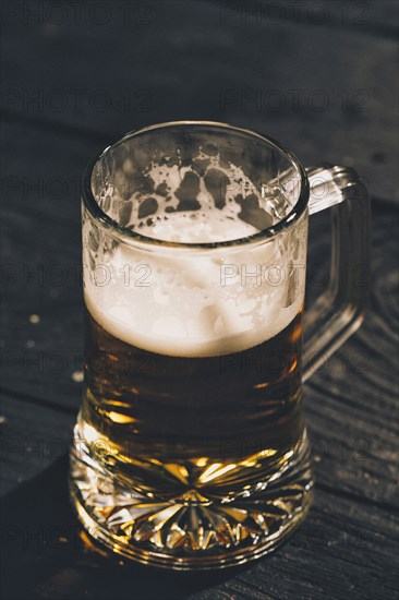 Glass of beer on table