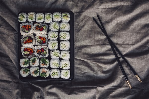 Close up of tray of sushi rolls