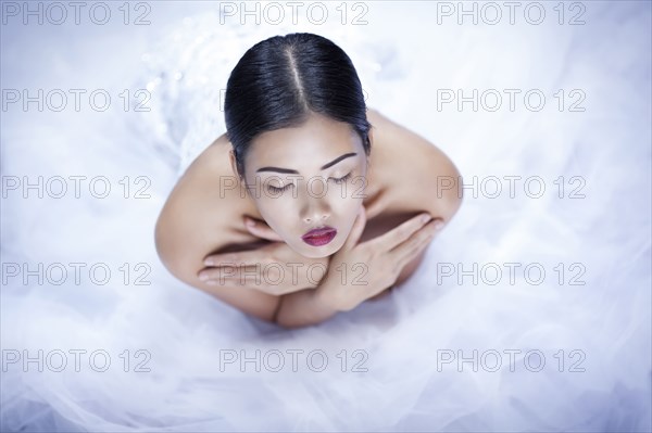 High angle view of glamorous woman wearing white gown