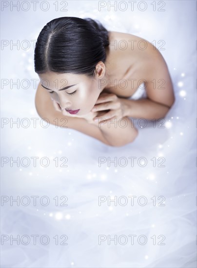High angle view of glamorous woman wearing white gown