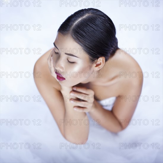 High angle view of glamorous woman wearing white gown