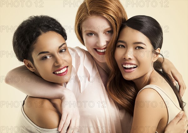 Close up of women smiling and hugging