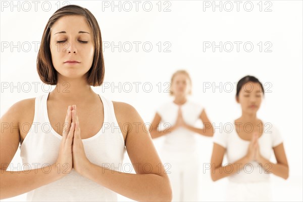 Women meditating in yoga class