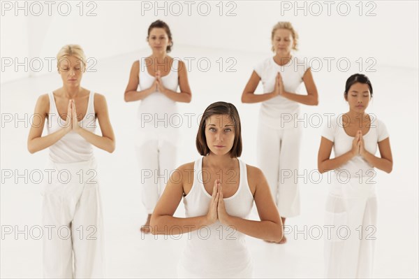 Women meditating in yoga class