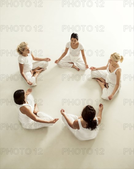 Women meditating in yoga class