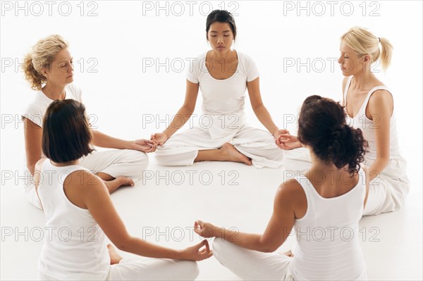 Women meditating in yoga class