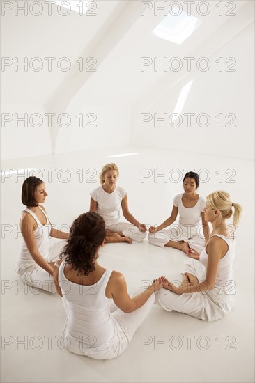 Women meditating in yoga class