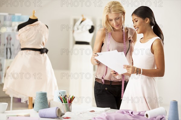 Fashion designers working together in studio