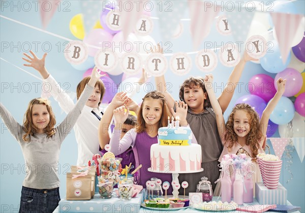 Children cheering at birthday party