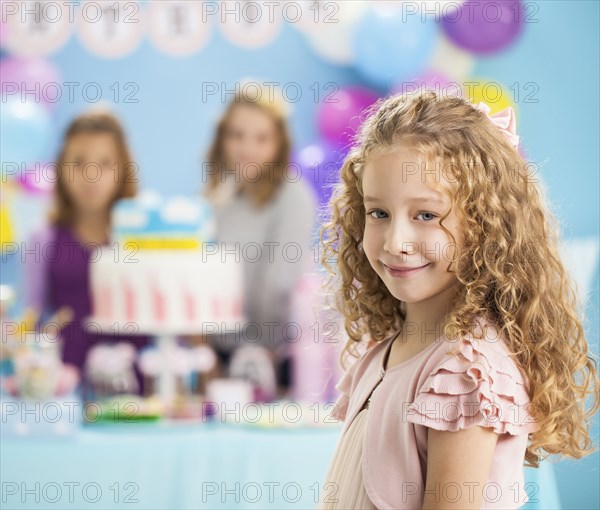 Girl smiling at birthday party