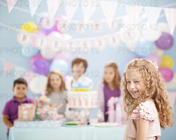 Girl smiling at birthday party