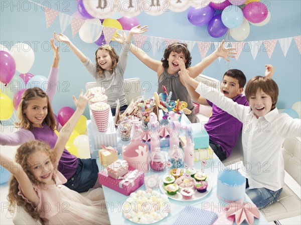 Children cheering at birthday party