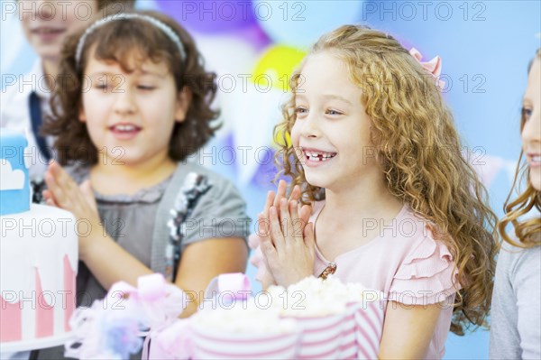 Children cheering at birthday party