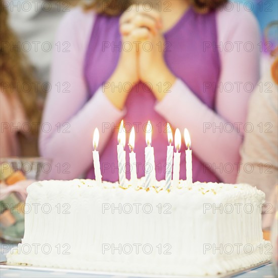 Close up of candles on birthday cake at party
