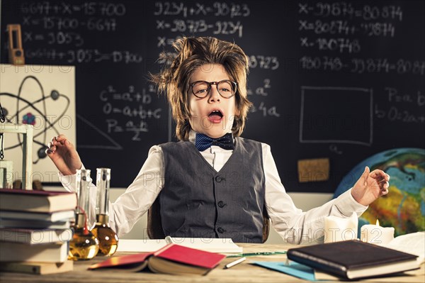 Student talking at desk in classroom