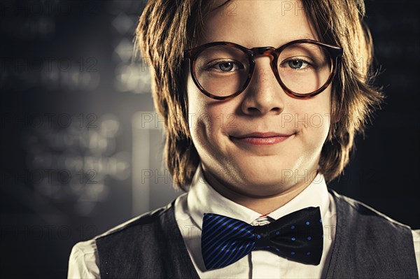 Close up of student wearing bow tie and eyeglasses