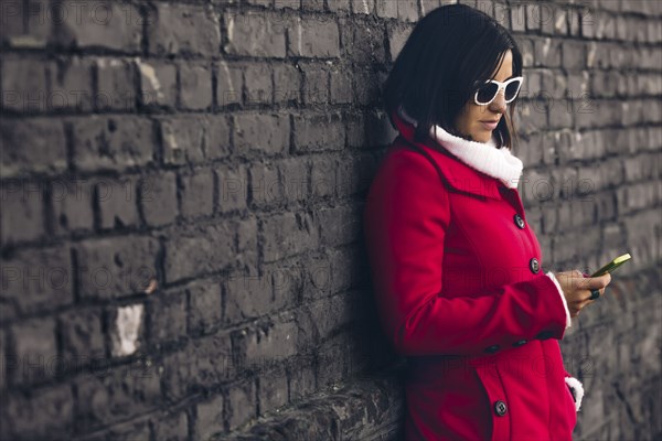 Caucasian woman using cell phone outdoors