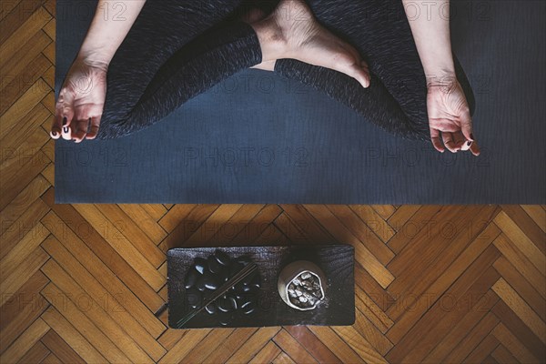 Caucasian woman meditating in yoga studio