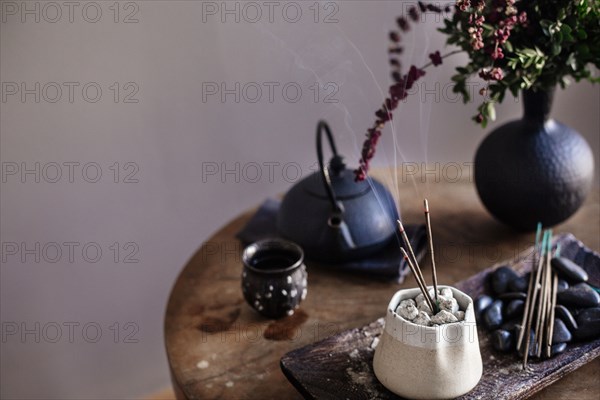 Incense burning on table