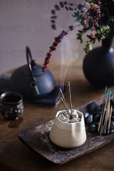 Incense burning on table