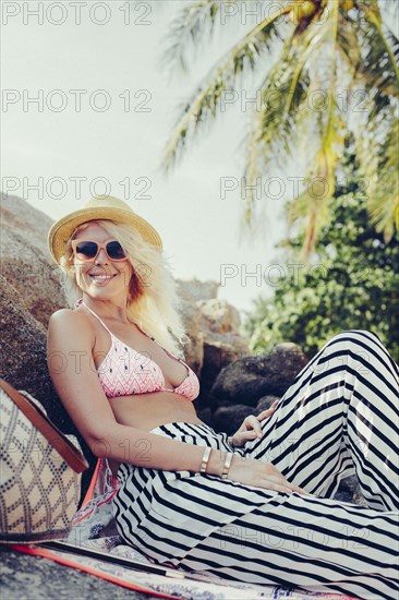 Caucasian woman sitting outdoors