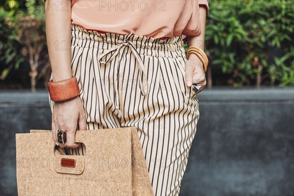 Caucasian woman carrying purse outdoors