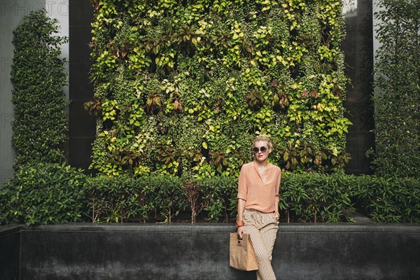 Caucasian woman carrying purse outdoors