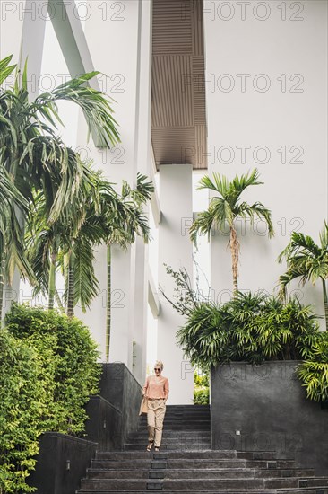 Caucasian woman walking on stairs