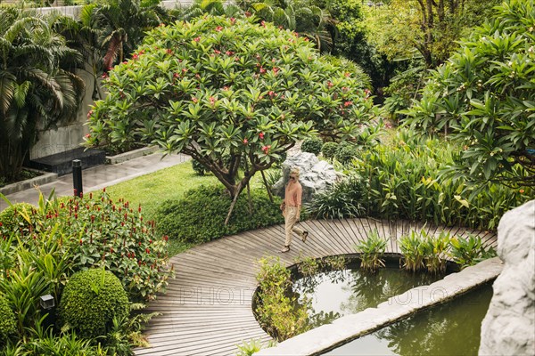 Caucasian woman walking in garden